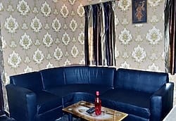 Blue upholstered lounge seating at Hotel Nataraj